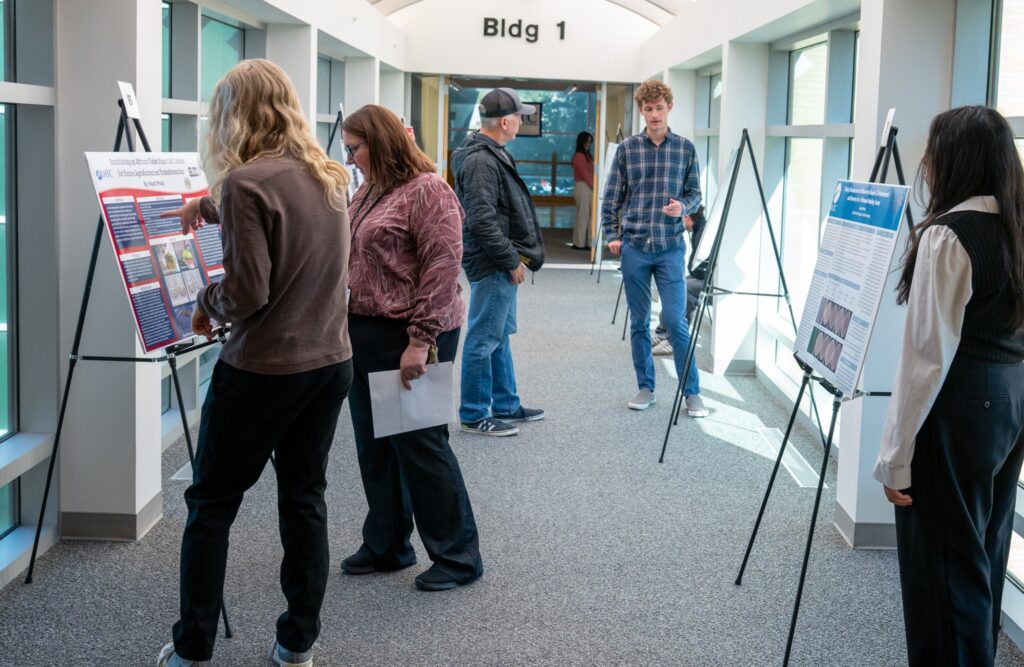 Students showcasing their biotech poster