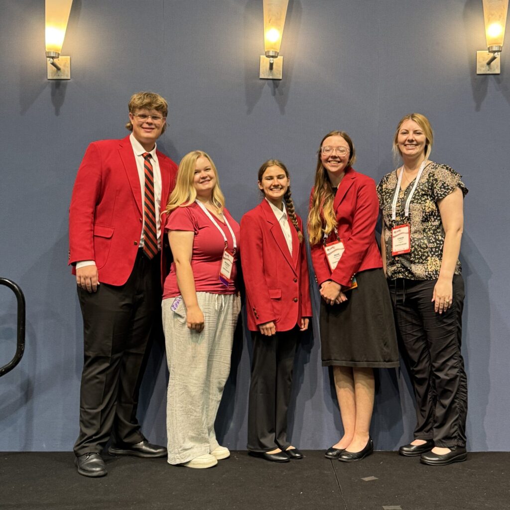 Students pose at competition